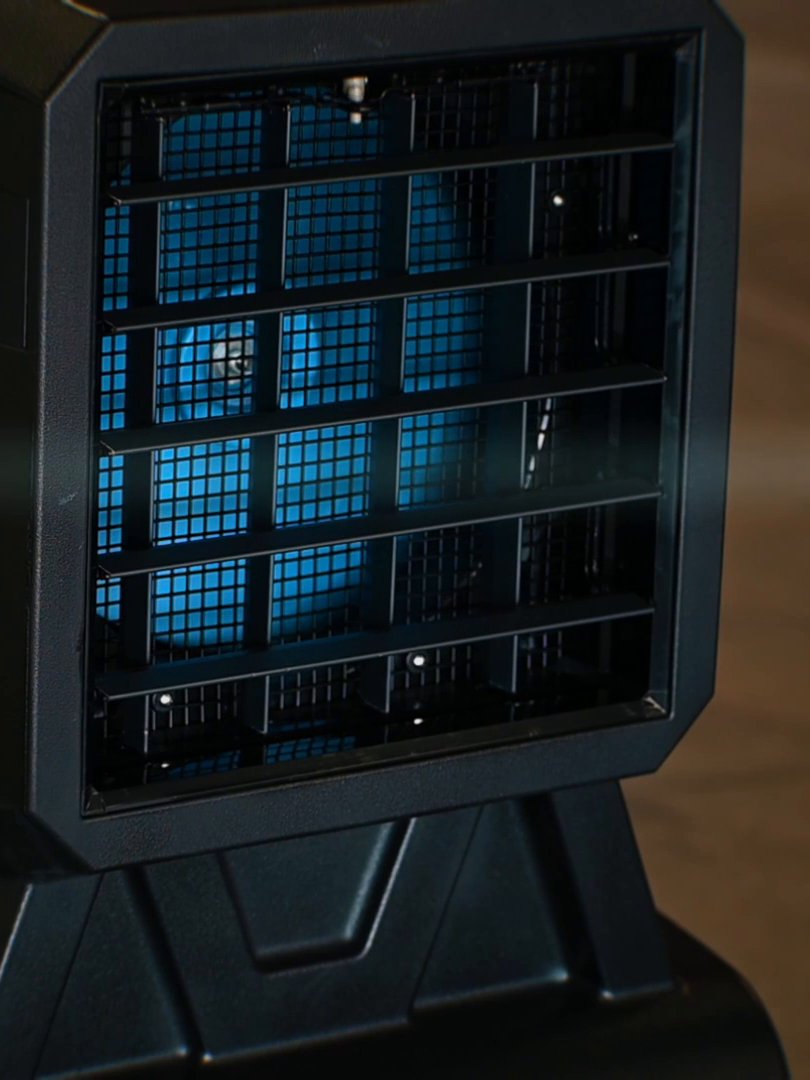 Front grille of an AIRSTREAM-12 evaporative cooler with the blue fan behind it