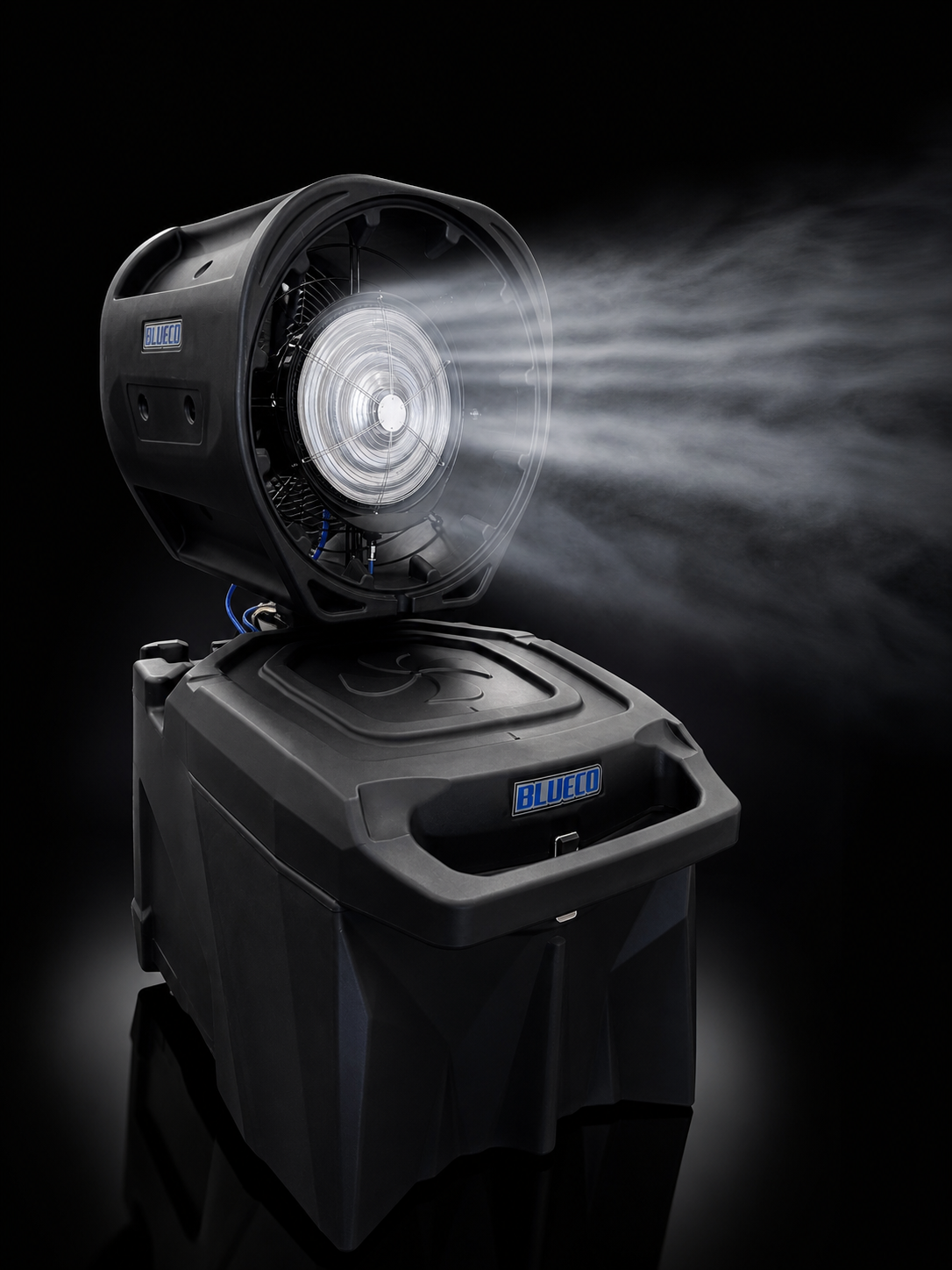 HydroBlu misting fan spraying a fine mist from its head above the tank, on black