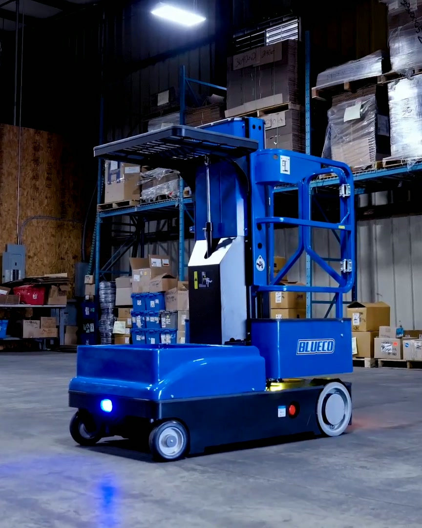 BLUECO order picker in a warehouse aisle, its blue path light on the floor ahead