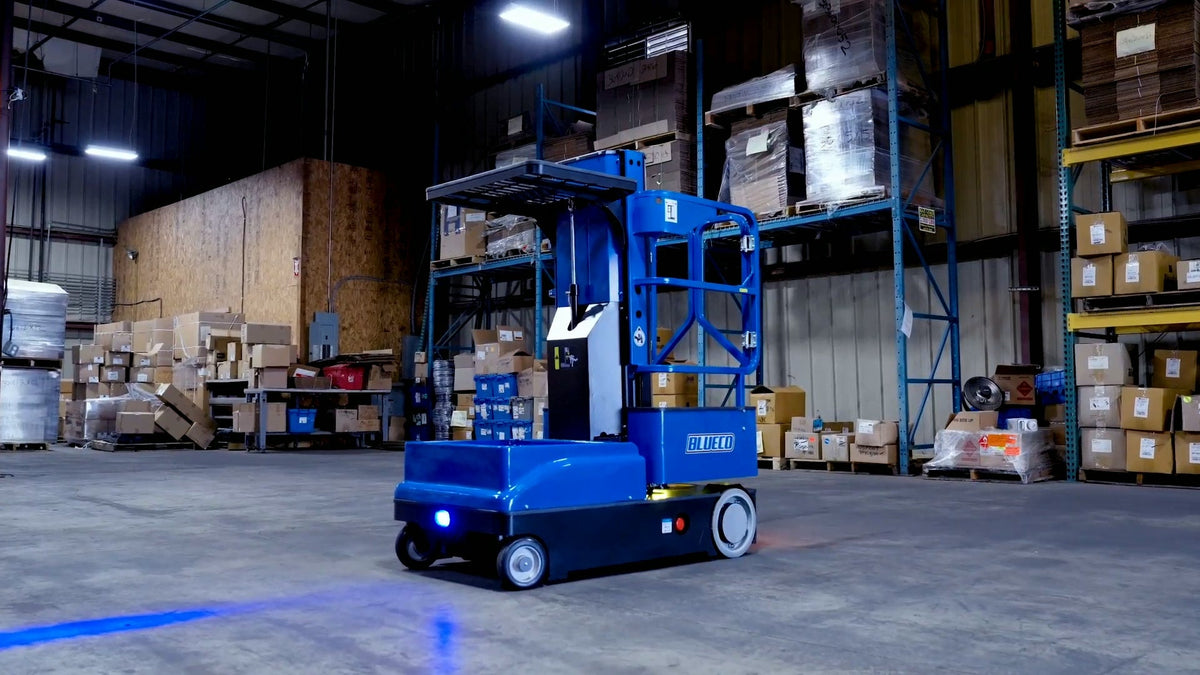 BLUECO order picker in a warehouse aisle, its blue path light on the floor ahead