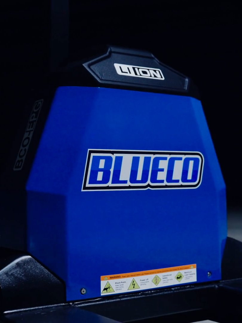 Electric pallet jack blue BLUECO housing with its LI-ION badge on top, in a dark studio